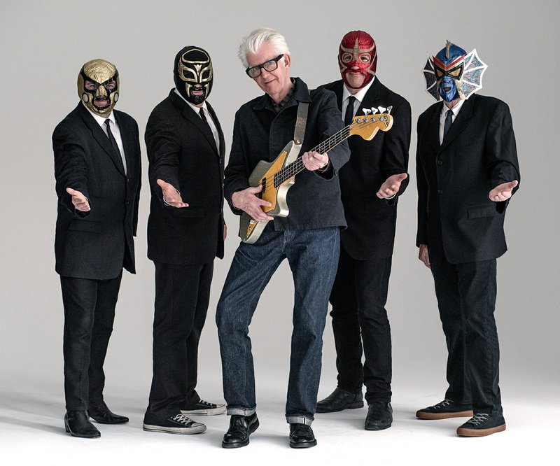 The Associated Press LOS STRAITJACKETS: This image released by Shorefire Media shows Nick Lowe, center, with members of Los Straitjackets, from left, Chris Sprague, Eddie Angel, Greg Townson and Pete Curry.