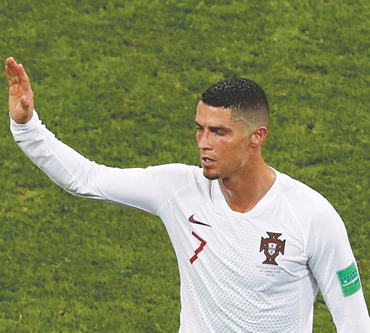 The Associated Press ITALIAN JOB: Portugal's Cristiano Ronaldo leaves the pitch after his team was eliminated, 2-1, by Uruguay in the round of 16 at the 2018 FIFA World Cup on June 30 at the Fisht Stadium in Sochi, Russia. Ronaldo subsequently completed a transfer from Real Madrid in Spain to Juventus in Italy.