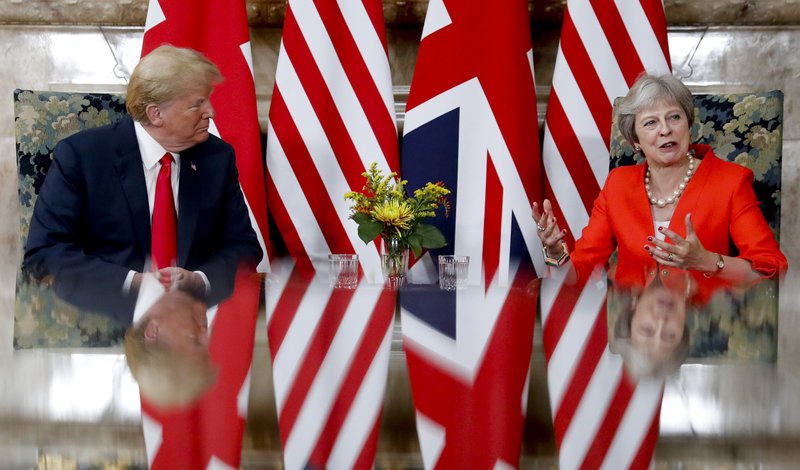 U.S. President Donald Trump, left, with British Prime Minister Theresa May, right, during their meeting at Chequers, in Buckinghamshire, England, Friday, July 13, 2018. (AP Photo/Pablo Martinez Monsivais)