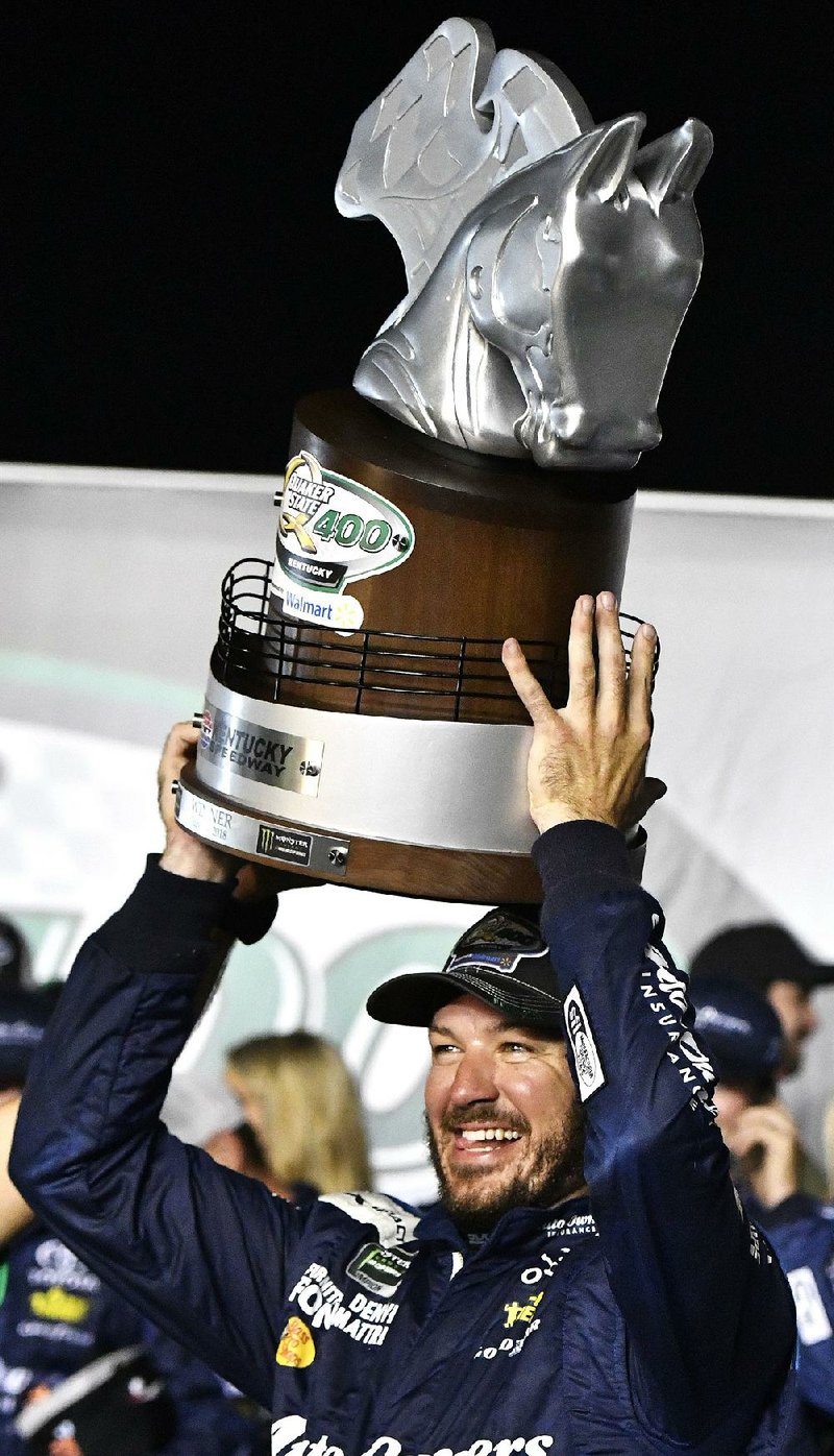 Martin Truex Jr. won the NASCAR Monster Energy Cup Series Quaker State 400, edging Ryan Blaney by 1.901 seconds at Kentucky Speedway.  