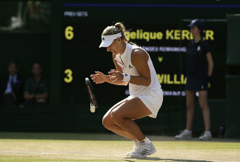 Angelique Kerber of Germany drops after completing her 6-3, 6-3 victory over American Serena Williams in the women’s final at Wimbledon on Saturday.  
