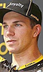 Netherlands' Dylan Groenewegen celebrates on the podium after the eight stage of the Tour de France cycling race over 181 kilometers (112.5 miles) with start in Dreux and finish in Amiens, France, Saturday, July 14, 2018. (AP Photo/Peter Dejong)