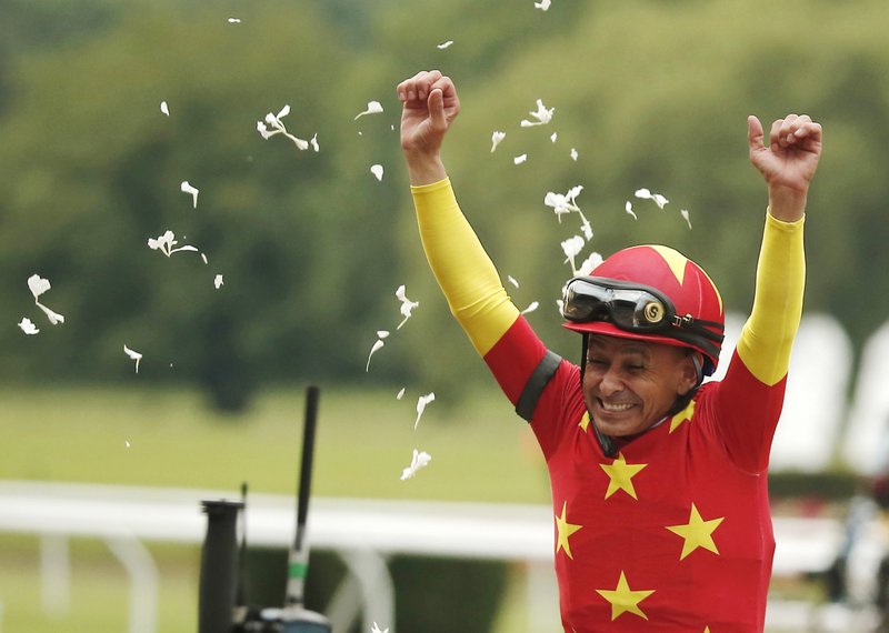 The Associated Press RACING HOME: In this June 9 file photo, jockey Mike Smith celebrates riding Justify to win the 150th running of the Belmont Stakes and capture horse racing's Triple Crown at Belmont Park in Elmont, N.Y. Smith recently returned to his home state of New Mexico to celebrate his historic Triple Crown victory.