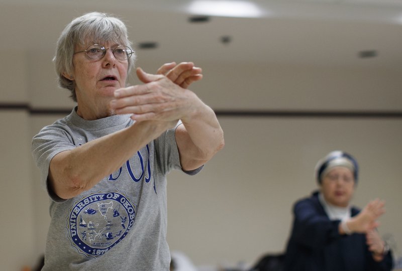 Marlene Burkgren, 67, of Ashburn, Va., teaches a Tai Chi class at Cascades Loudoun County Senior Center, Tuesday, July 10, 2018, in Sterling, Va. It stands to shift the direction of the nation&#x2019;s highest court for decades, but President Donald Trump&#x2019;s move to fill a Supreme Court vacancy has barely cracked the consciousness of voters in the nation&#x2019;s top political battlegrounds. In northern Virginia, 
 here two-term Congresswoman Barbara Comstock is considered one of the nation&#x2019;s most vulnerable Republicans, Burkgren says she feels powerless to stop Trump&#x2019;s party from confirming Kavanaugh. &#x201c;I&#x2019;m a little disappointed with the way things have worked out,&#x201d; said Burkgren, a volunteer teach tai chi teacher at the local senior center.(AP Photo/Carolyn Kaster)