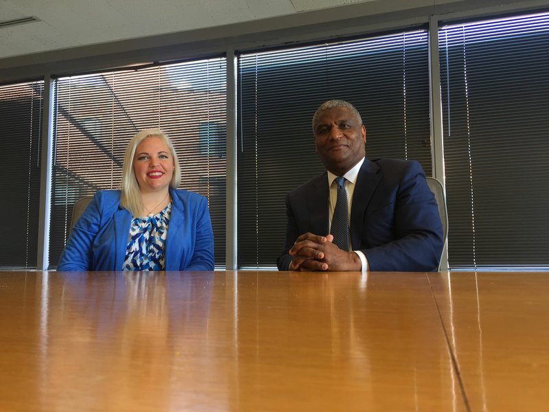 UA law student Katie Rose Martin meets with former U.S. Transportation Secretary Rodney Slater on Friday in Washington. Martin is the first student at the school in Fayetteville to receive a public-policy fellowship from the Squire Patton Boggs Foundation of which Slater is the board chairman.