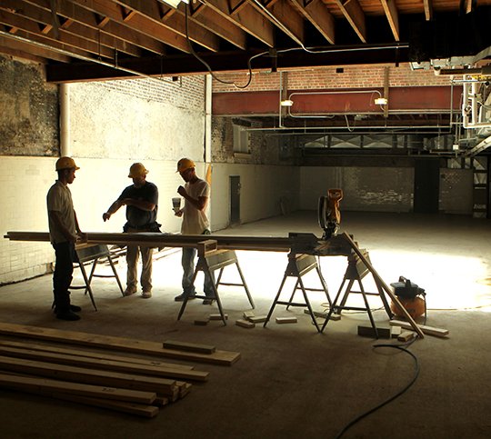 The Sentinel-Record/Richard Rasmussen HARD AT WORK: Crew members with Harrison Construction Co. begin to frame an area in what will be the dining room at the Hale Bath House Friday. Demolition began July 2, according to Pat McCabe.