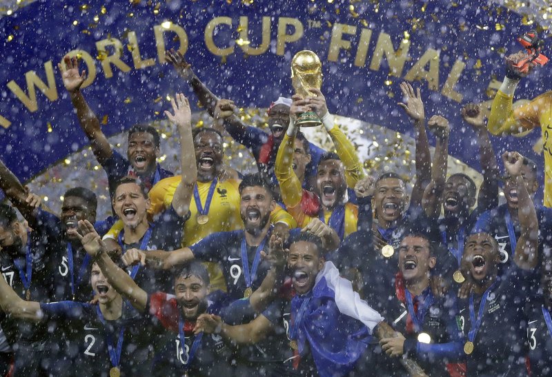The Associated Press CHAMPIONS: France goalkeeper Hugo Lloris holds the trophy aloft after defeating Croatia, 4-2, Sunday in the 2018 FIFA World Cup final in the Luzhniki Stadium in Moscow, Russia.
