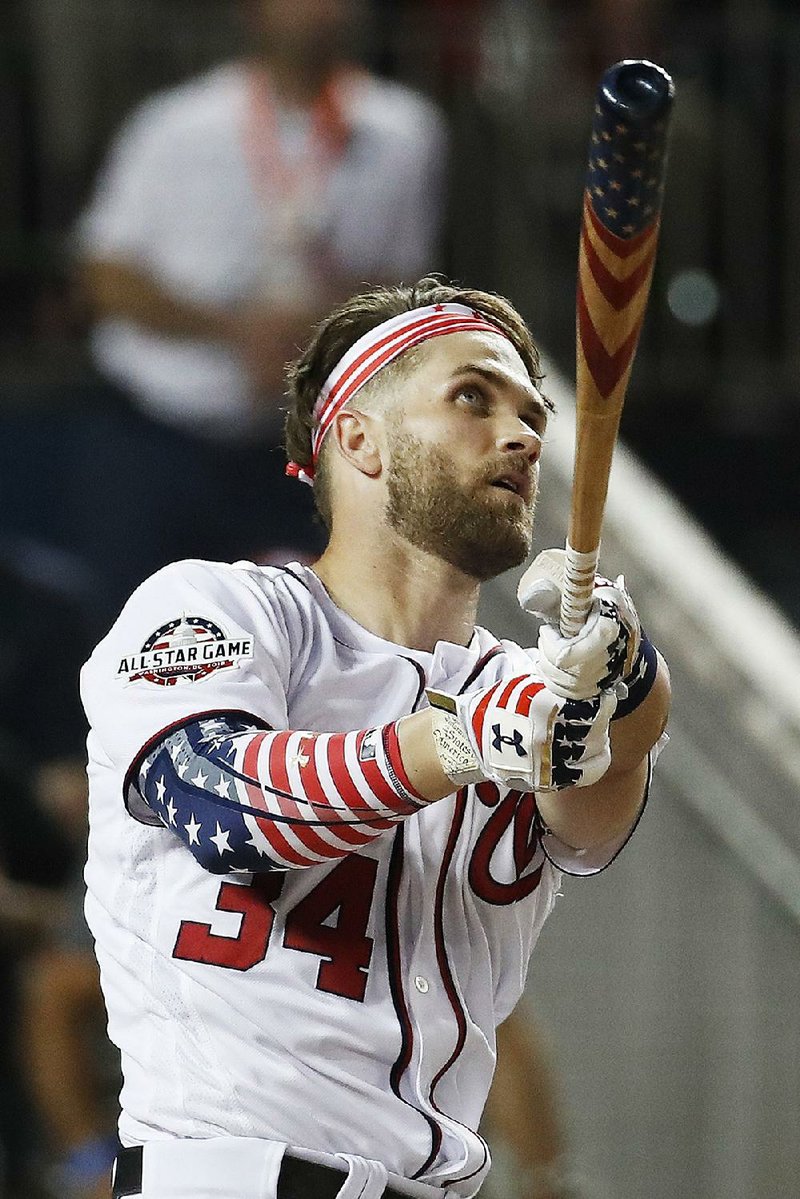 Bryce Harper of the Washington Nationals outslugged Kyle Schwarber to win the MLB Home Run Derby on Monday at Nationals Park in Washington. Harper edged Schwarber 19-18 in the final round, hitting 45 home runs total. 