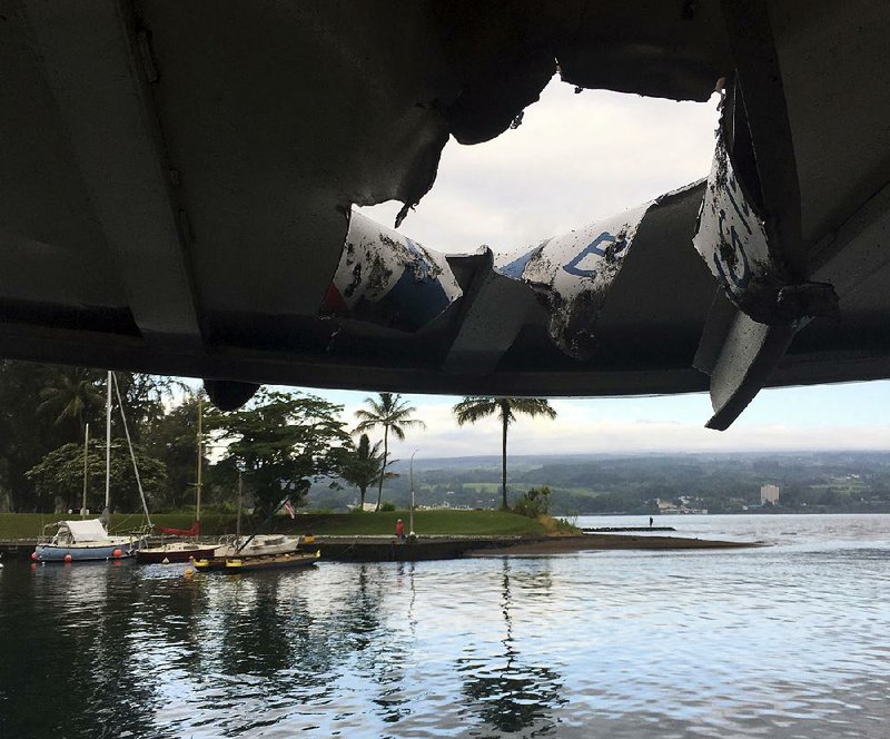 This photo provided by the Hawaii Department of Land and Natural Resources shows damage to the roof of a tour boat after an explosion sent lava flying through the roof off the Big Island of Hawaii on Monday, injuring dozens of people.  
