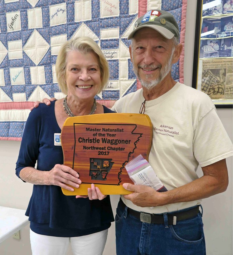 Courtesy photo Christie Waggoner receives her Master Naturalist of the Year award from Steve Sampers.