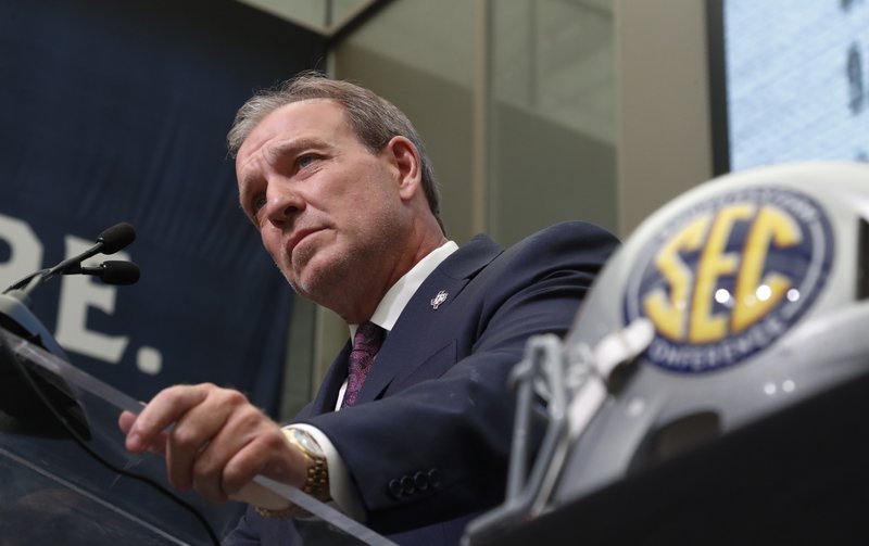 The Associated Press AGGIE FEVER: Texas A&M head coach Jimbo Fisher speaks during the Southeastern Conference's football media days Monday at the College Football Hall of Fame in Atlanta.