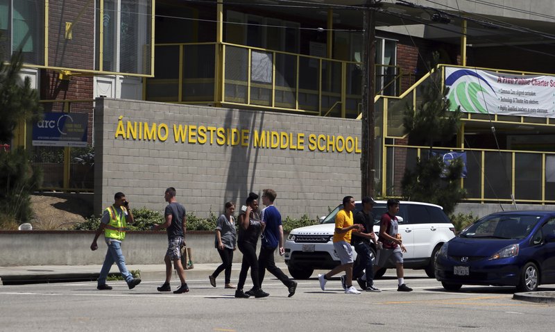 In this Friday, July 13, 2018 photo, Animo Westside Charter Middle School is seen during a summer session to introduce new students to the school they will attend in the fall, in the Playa Del Rey area of Los Angeles. Animo is one of many schools to benefit from donations by billionaires that are influencing state education policy by giving money to state-level charter support organizations to sustain, defend and expand the charter schools movement across the country. (AP Photo/Reed Saxon)