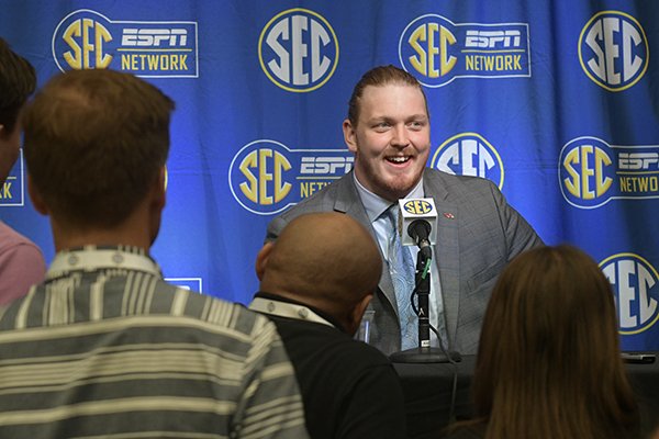 Arkansas offensive lineman Hjalte Froholdt, of Denmark, is interviewed during the NCAA college football Southeastern Conference media days at the College Football Hall of Fame in Atlanta, Tuesday, July 17, 2018. (AP Photo/John Amis)