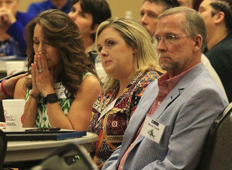 Michele Eakin Smith (from left) of Maumelle, Amy Whitcomb of Benton and David Clark of Sherwood attend Tuesday’s Never Forgotten Arkansas Takes Action lunch in Benton where families of missing people were recognized. Eakin Smith’s brother, Daniel Eakin; Whitcomb’s father, Gary Mullinax; and Clark’s mother, Patsy Clark, were among those recognized as missing.  