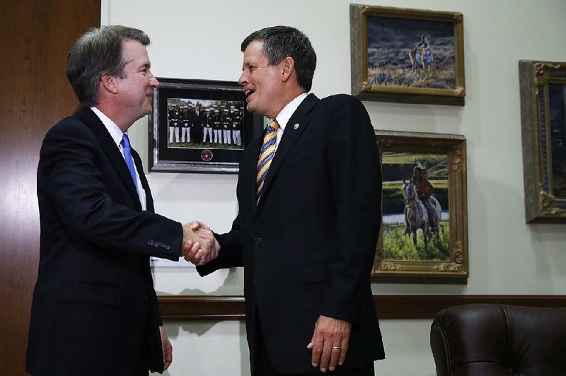 Judge Brett Kavanaugh (left) meets with Sen. Steve Daines, R-Mont., on Tuesday at Daines’ office on Capitol Hill.  