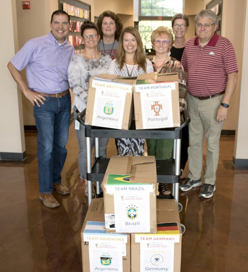 Photo submitted DaySpring employees contributed cash and food items for the 2018 in-house Manna Center Drive. The drive was held in June this year using the soccer championship theme. The winning team (based on cash and items given) was Brazil, followed by Germany, Portugal and Argentina. Mark Brooker, executive director of The Manna Center, far right, picked up 166 non-perishable items and $319 in cash provided through this year's drive. Pictured are Dominique Seitz, co-leader of the DaySpring Ministry Opportunity Team, along with other teams' members, and Brooker. As the Manna Center adds to its client base, the organization has a greater need for non-perishable food items, as well as cash donations. Due to their ability to buy in bulk, the center can purchase a lot more food for $1 than an individual purchasing an item retail. The need for donations increases even more in the summer when kids are out of school and may not be able to take advantage of free school meals.