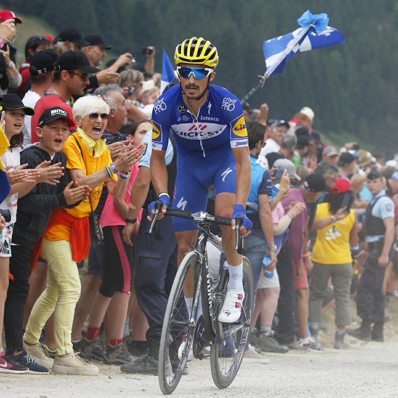 The Associated Press STAGE LEFT: Stage winner Julian Alaphilippe, of France, rides breakaway Tuesday during the 10th stage of the Tour de France over 198.7 miles with the start in Annecy and finish in Le Grand-Bornand.