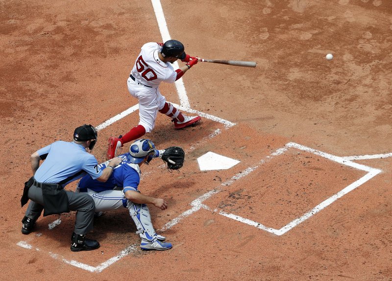 Boston Red Sox's Mookie Betts hits a single against the Toronto Blue Jays during the third inning of a baseball game Saturday, July 14, 2018, in Boston. (AP Photo/Winslow Townson)