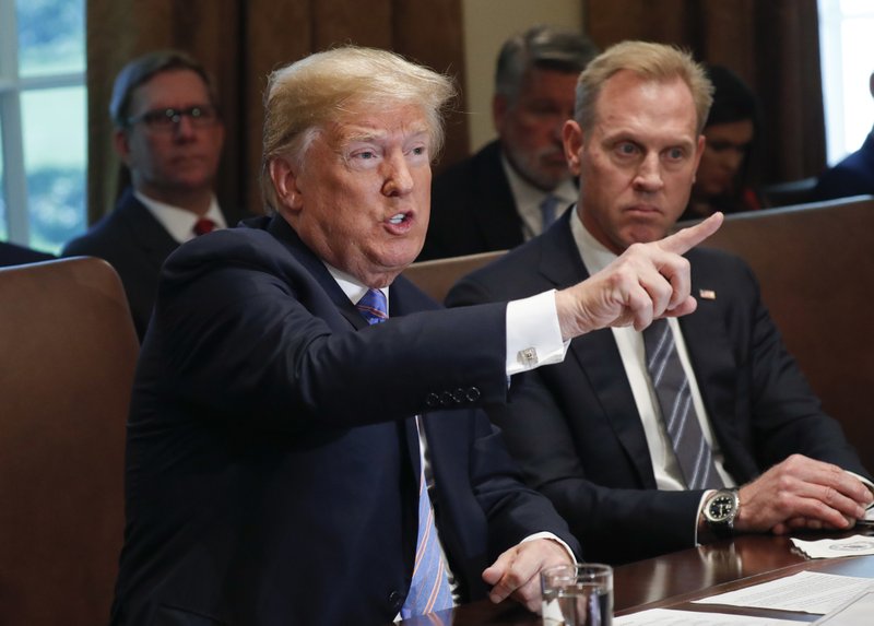 President Donald Trump gestures while speaking during his meeting with members of his cabinet in Cabinet Room of the White House in Washington, Wednesday, July 18, 2018. Looking on is Deputy Secretary of Defense Patrick Shanahan. (AP Photo/Pablo Martinez Monsivais)