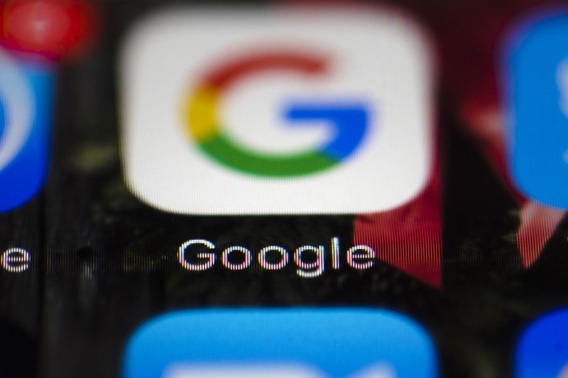 FILE - This Wednesday, April 26, 2017 file photo shows a Google icon on a mobile phone, in Philadelphia. European Union antitrust chief Margrethe Vestager is planning a statement on Wednesday, July 18, 2018 amid reports that her office will slap a record $5 billion fine on Google for abuse of its dominant position in the Android mobile phone operating systems. The decision was widely expected this week and financial media, including Bloomberg and the Financial Times, said the amount would total 4.3 billion euros. (AP Photo/Matt Rourke, File)

