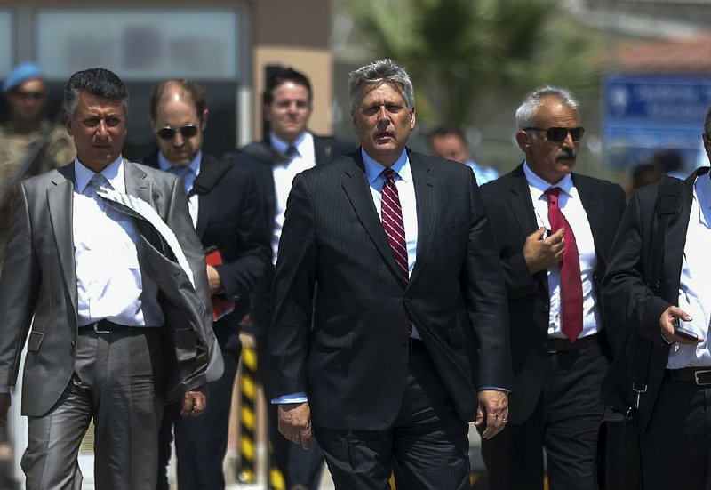 Philip Kosnett (center), the U.S. Embassy’s charge d’affaires in Ankara, Turkey, leaves a prison complex in Aliaga after attending the trial Wednesday of jailed American pastor Andrew Brunson. 