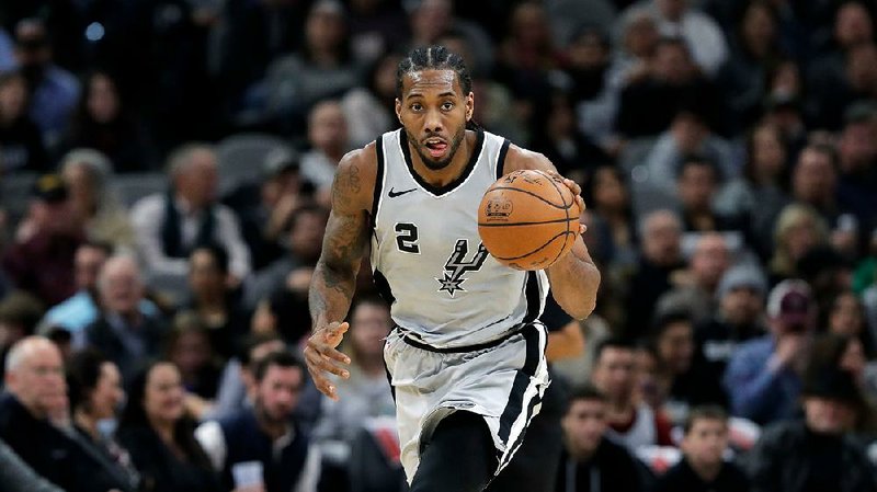 Guards Kawhi Leonard (shown) and DeMar DeRozan were traded for one another Wednesday, part of a four-player deal that sent Leonard to Toronto and DeRozan to San Antonio. The Spurs also got center Jakob Poeltl and a 2019 protected first-round draft pick, while the Raptors acquired sharpshooter Danny Green.