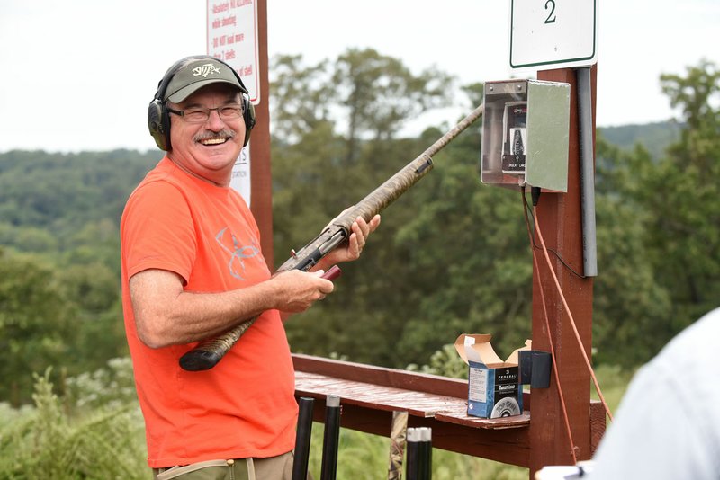 FILE PHOTO NWA Democrat-Gazette/FLIP PUTTHOFF Burt Bush of Rogers reacts to making a difficult shot at the 2017 "AIM for Advocacy" sporting clays benefit tournament for Restoration Village at Spring Valley Anglers Rod & Gun Club in Gravette. This year's tournament Aug. 18 will be preceded by the "Restoring Hope Barn Bash" on Aug. 17 in Bentonville.