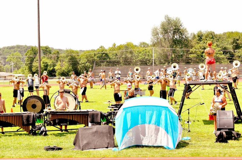 RACHEL DICKERSON/MCDONALD COUNTY PRESS The Pioneer Drum and Bugle Corps practices on the football field at McDonald County High School on Monday.