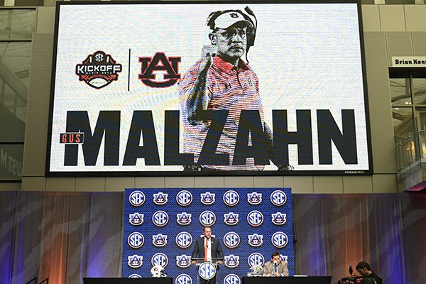 NCAA college football head coach Gus Malzahn of Auburn speaks during the Southeastern Conference Media Days at the College Football Hall of Fame in Atlanta, Thursday, July 19, 2018. (AP Photo/John Amis)	