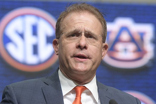 NCAA college football head coach Gus Malzahn of Auburn speaks during the Southeastern Conference Media Days at the College Football Hall of Fame in Atlanta, Thursday, July 19, 2018. (AP Photo/John Amis)

