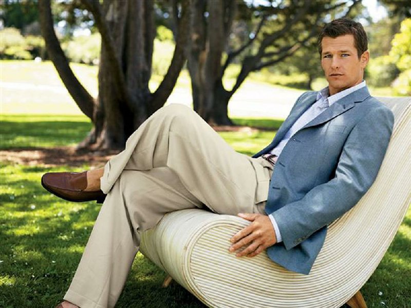 When the weather is warmer, men can loosen up on what they wear to work. This combination of a light blue sports coat, khakis and shirt with no tie is just fi ne in many workplaces. 