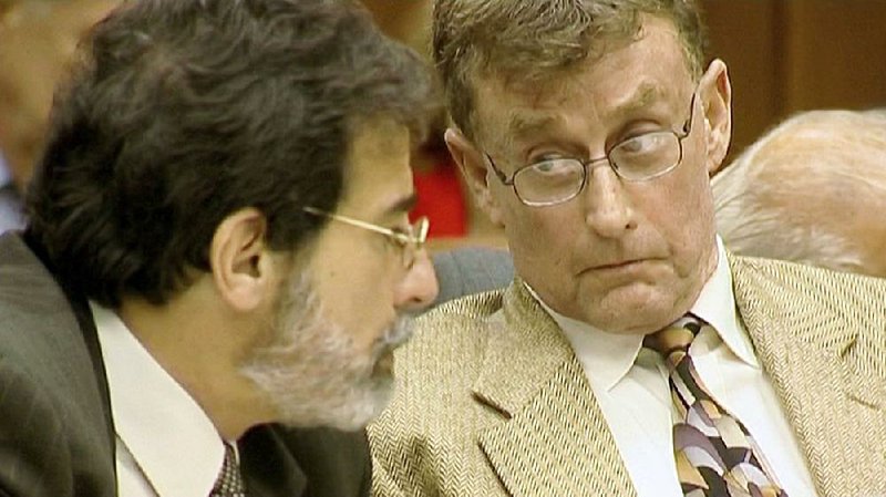 Michael Peterson (right) discusses his case with attorney David Rudolf in The Staircase on Netflix. 
