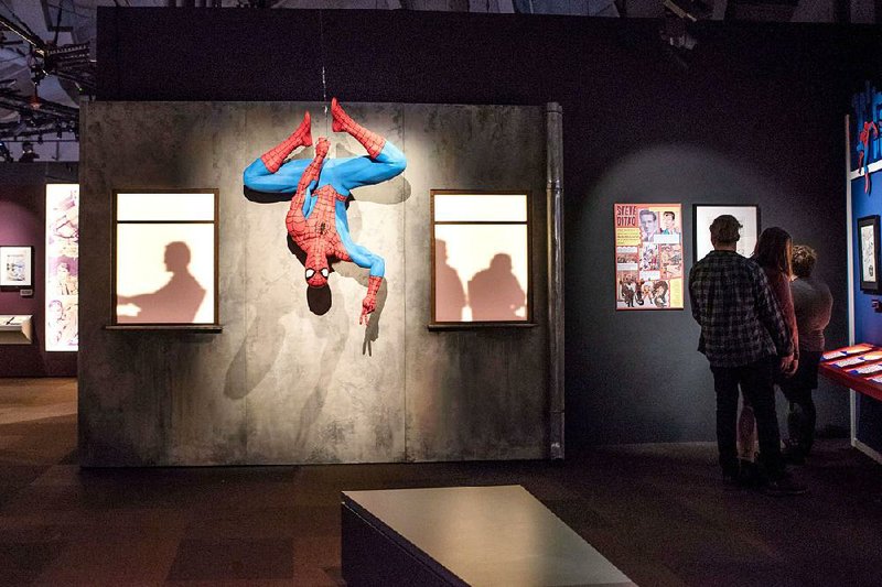 Spider-Man hangs around the Marvel Universe of Super Heroes exhibit at the Museum of Pop Culture in Seattle. 