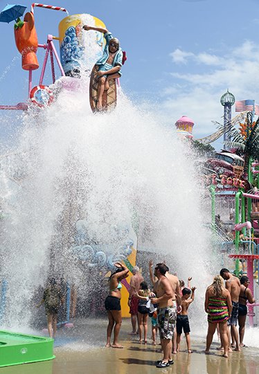The Sentinel-Record/Grace Brown SPLASH DOWN: Magic Springs Theme and Water Park guests cool down at Splash Island on Thursday, as the air temperature rose above 100 degrees.