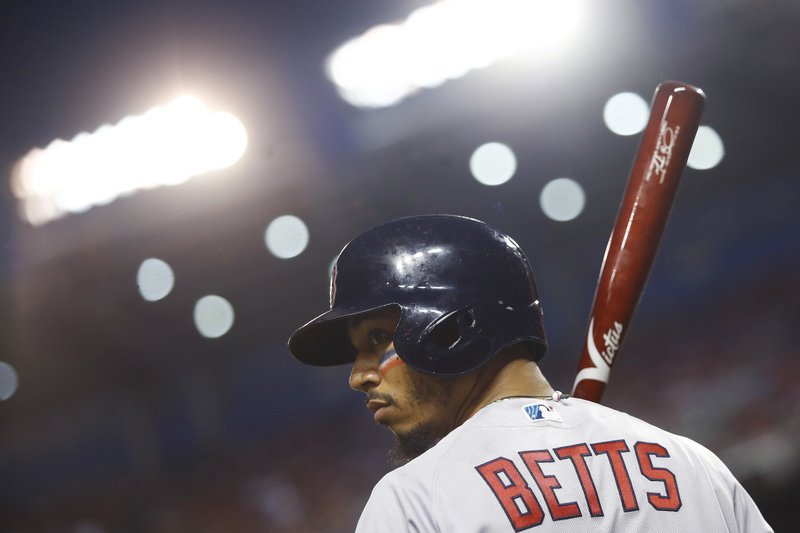 Boston Red Sox outfielder Mookie Betts (50) looks across the field during the first inning of the Major League Baseball All-star Game, Tuesday, July 17, 2018 in Washington. (AP Photo/Patrick Semansky)
