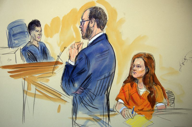 This courtroom sketch depicts Maria Butina, a 29-year-old gun-rights activist suspected of being a covert Russian agent, listening to Assistant U.S. Attorney Erik Kenerson as he speaks to Judge Deborah Robinson, left, during a hearing in federal court in Washington, Wednesday, July 18, 2018. Prosecutors say Butina was likely in contact with Kremlin operatives while living in the United States. And prosecutors also are accusing her of using sex and deception to forge influential connections. (Dana Verkouteren via AP)