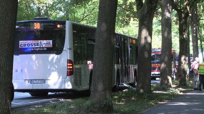 A bus stands on a street in Luebeck, northern Germany, Friday, July 20, 2018 after a man attacked people inside. (TNN/dpa via AP)
