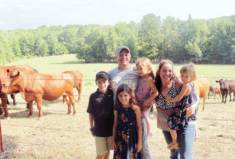 The Damon Helton family of Lonsdale is the 2018 West Central District Farm Family of the Year, as well as the Saline County Farm Family of the Year. Family members include, Olivia, front; and back row, from left, Luke; Damon, holding Violet; and Jana, holding Elena. The family raises grass-fed beef, forested hogs and pastured broilers and operates the Olde Crow General Store in the Crows community.
