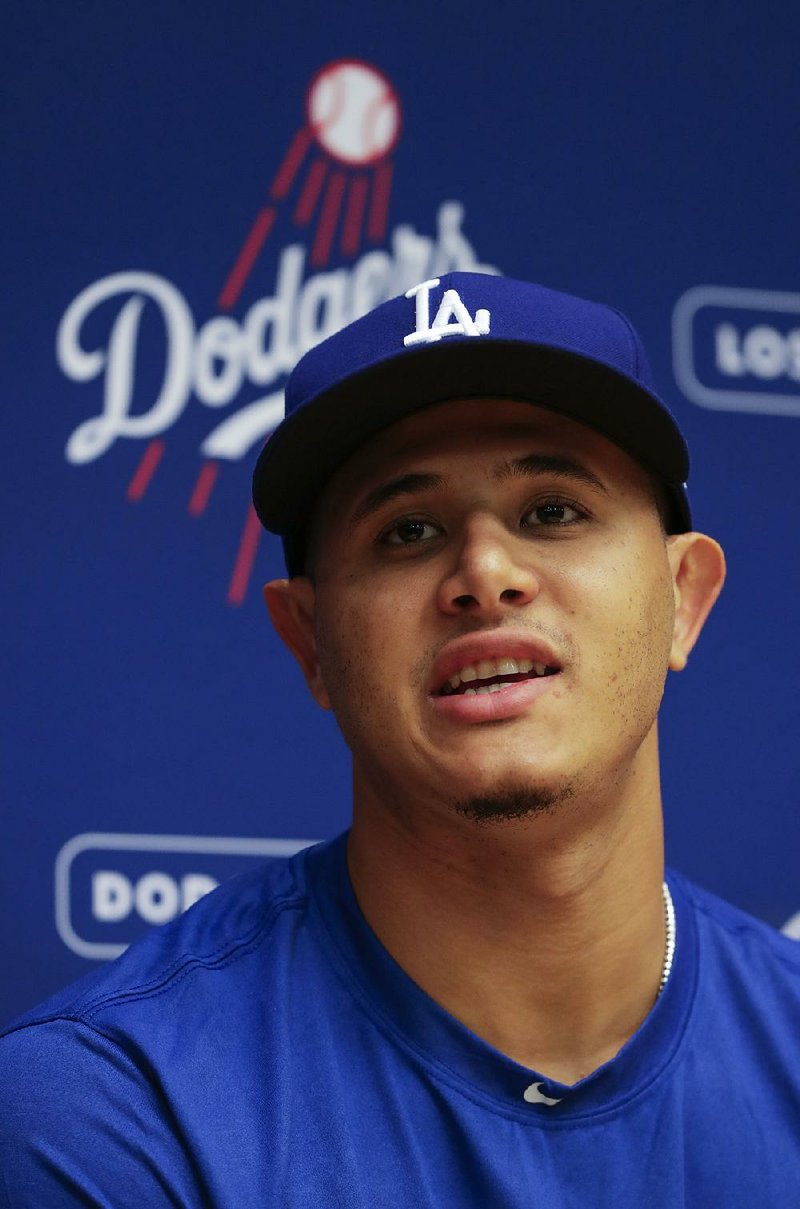 Los Angeles Dodgers' Manny Machado speaks at a news conference before a baseball game against the Milwaukee Brewers Friday, July 20, 2018, in Milwaukee. 