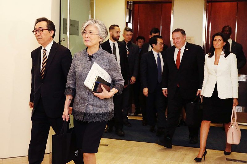 South Korea’s U.N. ambassador, Cho Tae-yul, (left) walks with Foreign Minister Kang Kyung-wha ahead of U.S. Secretary of State Mike Pompeo (second from right) with U.S. Ambassador Nikki Haley as they head to a meeting Friday at South Korea’s mission in New York. 