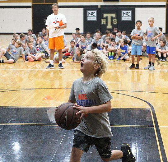 The Sentinel-Record/Richard Rasmussen TROJAN PRIDE: Noah Lyles, of Hot Springs, dribbles for a basket Friday morning during the final day of the fifth annual Nike Boys Basketball Camp at Hot Springs World Class High School's Trojan Fieldhouse.