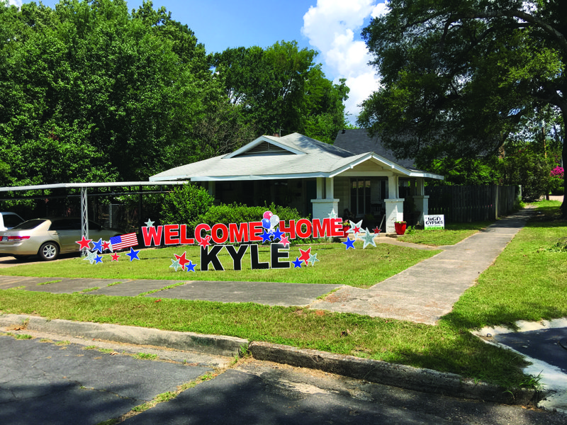 Home: Kyle Smith returned home after over a year of deployment to a yard full of welcome home signs. The signs were placed by the Sign Gypsies — Union County, who put the signs in yards “like gypsies in the night.”