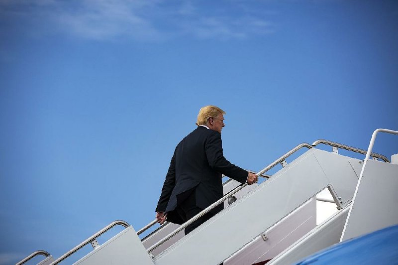 President Donald Trump boards Air Force One at Andrews Air Force Base on Friday for a trip to his golf course in Bedminster, N.J. In a Twitter post early Saturday, Trump lashed out at former attorney Michael Cohen over secretly recording a conversation about a potential payment to a woman.   