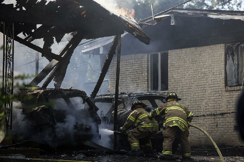 Firefighters battle a blaze on Broadmoor Drive in Little Rock that sent one person to the hospital Saturday. More photos are available at arkansasonline.com/galleries. 