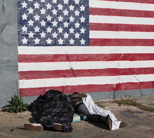 The Sentinel-Record/Richard Rasmussen HOMELESS: A couple of unidentified people sleep near the intersection of Central and Ouachita avenues on Monday, April 30. This year, 215 people were documented as homeless or living in shelters in Garland County.