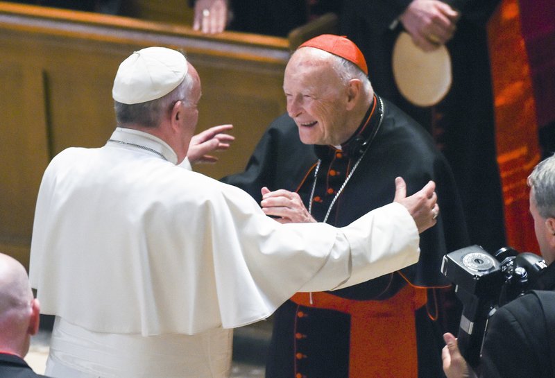 In this Sept. 23, 2015 file photo, Pope Francis reaches out to hug Cardinal Archbishop emeritus Theodore McCarrick after the Midday Prayer of the Divine with more than 300 U.S. Bishops at the Cathedral of St. Matthew the Apostle in Washington. Allegations that the most respected U.S. cardinal repeatedly sexually abused both boys and adult seminarians has raised questions about who in the Catholic Church hierarchy knew, and what Pope Francis is going to do about it. (Jonathan Newton/The Washington Post via AP, Pool, File)