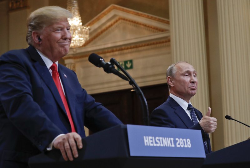 Russian President Vladimir Putin, right, and U.S. President Donald Trump give a joint news conference at the Presidential Palace in Helsinki, Finland, on Monday, July 16, 2018. (AP Photo/Pablo Martinez Monsivais)