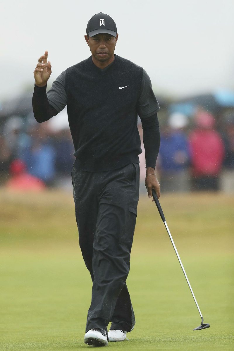 Tiger Woods of the US gestures after playing a birdie on the 4th hole during the second round of the British Open Golf Championship in Carnoustie, Scotland, Friday July 20, 2018. 