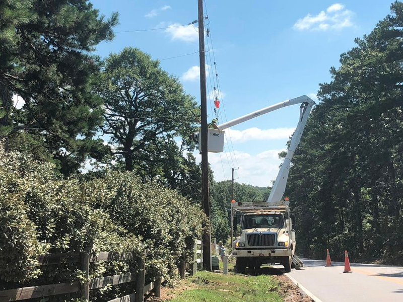 A crew from Utility Lines Construction Services works to restore power at Kanis Road and Iron Horse Road in Little Rock. 
