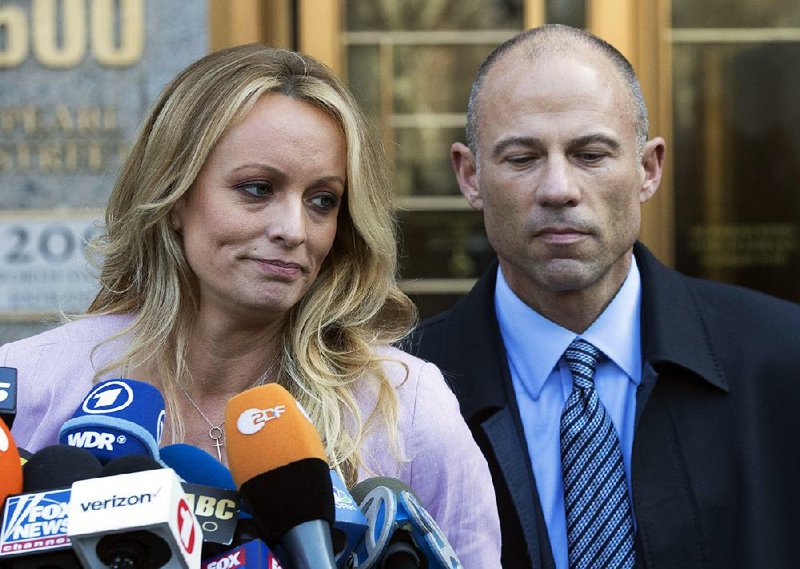  In this April 16, 2018 file photo, adult film actress Stormy Daniels, left, stands with her lawyer Michael Avenatti as she speaks outside federal court, in New York. 